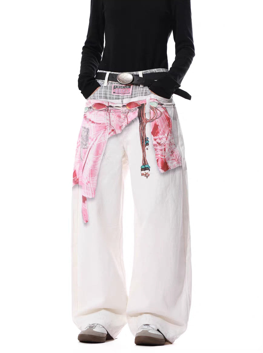 Front angled view of wide-leg graphic pants showing layered-look waistband detail