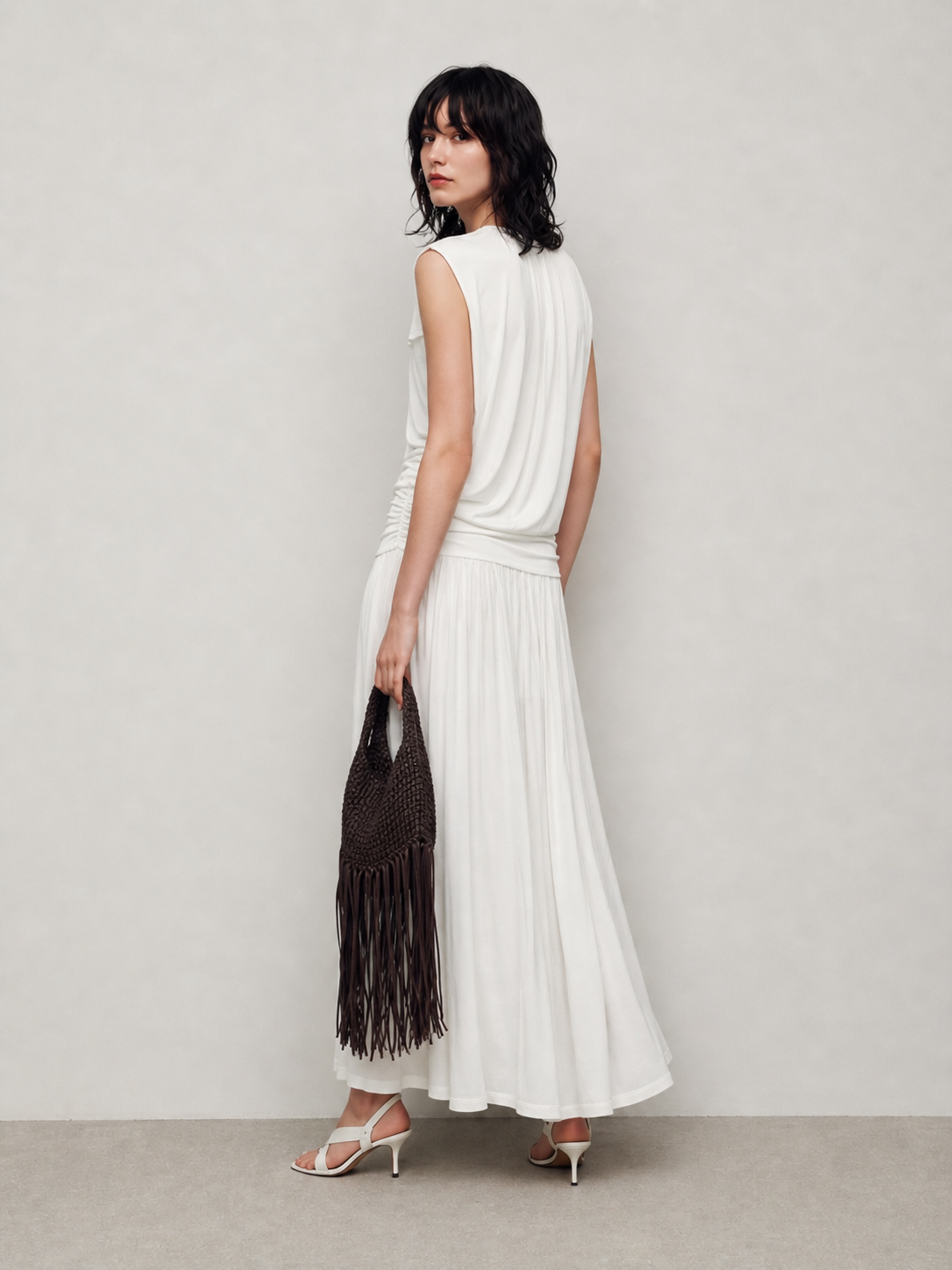 BapHood white maxi skirt set showing the high-waist fit, pleated drape, and long fluid shape.