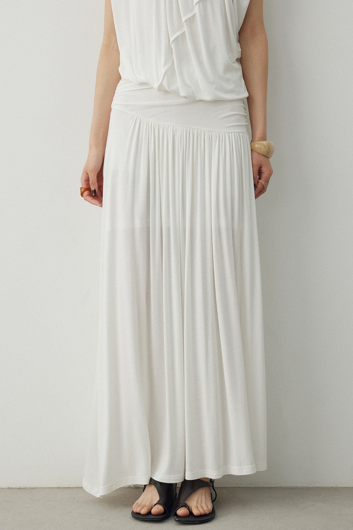 BapHood white ruched skirt set with a close view of the sleeveless top and deconstructed drape.