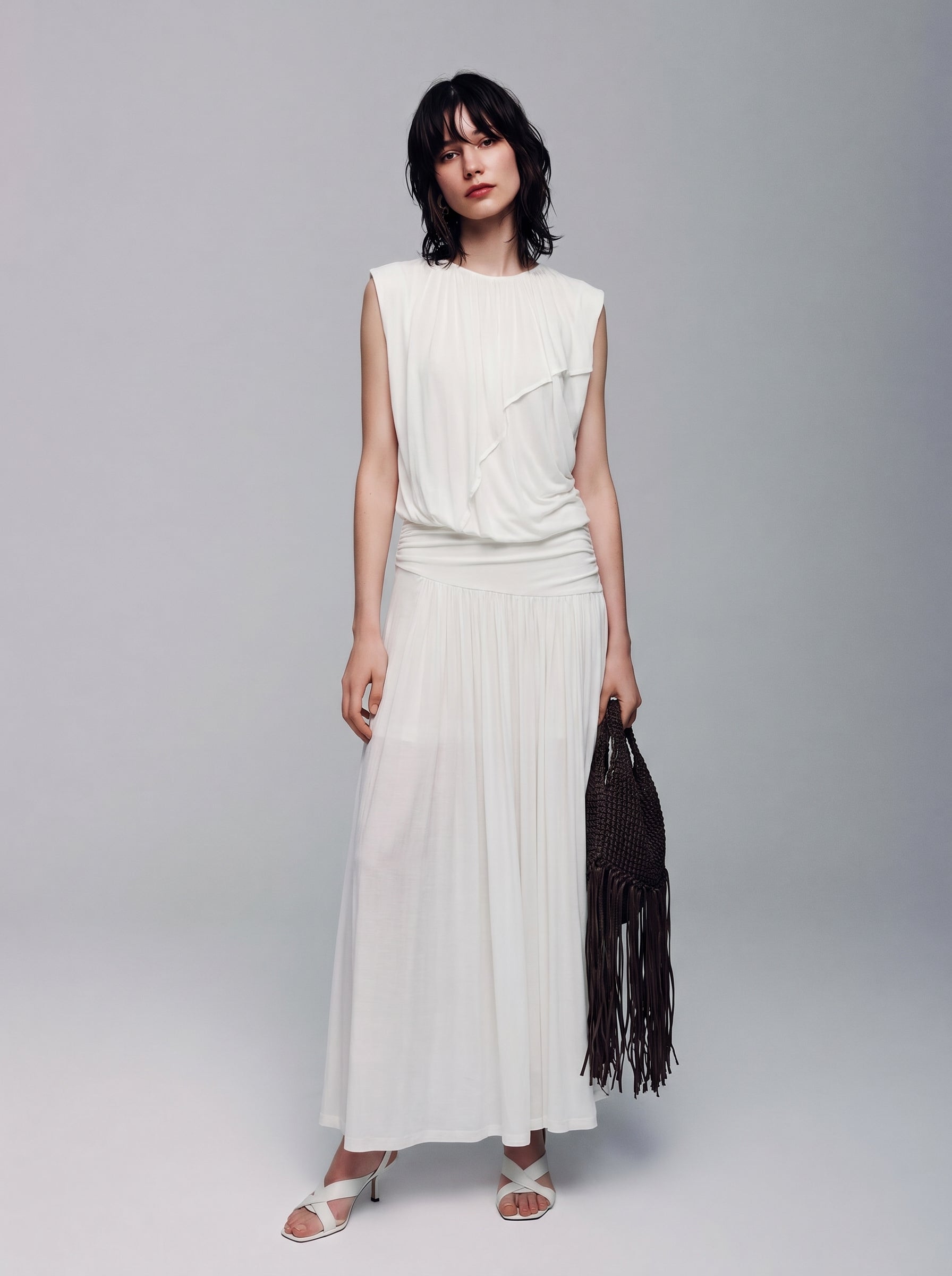 BapHood white ruched two-piece skirt set with a sleeveless U-neck top and flowing maxi skirt.
