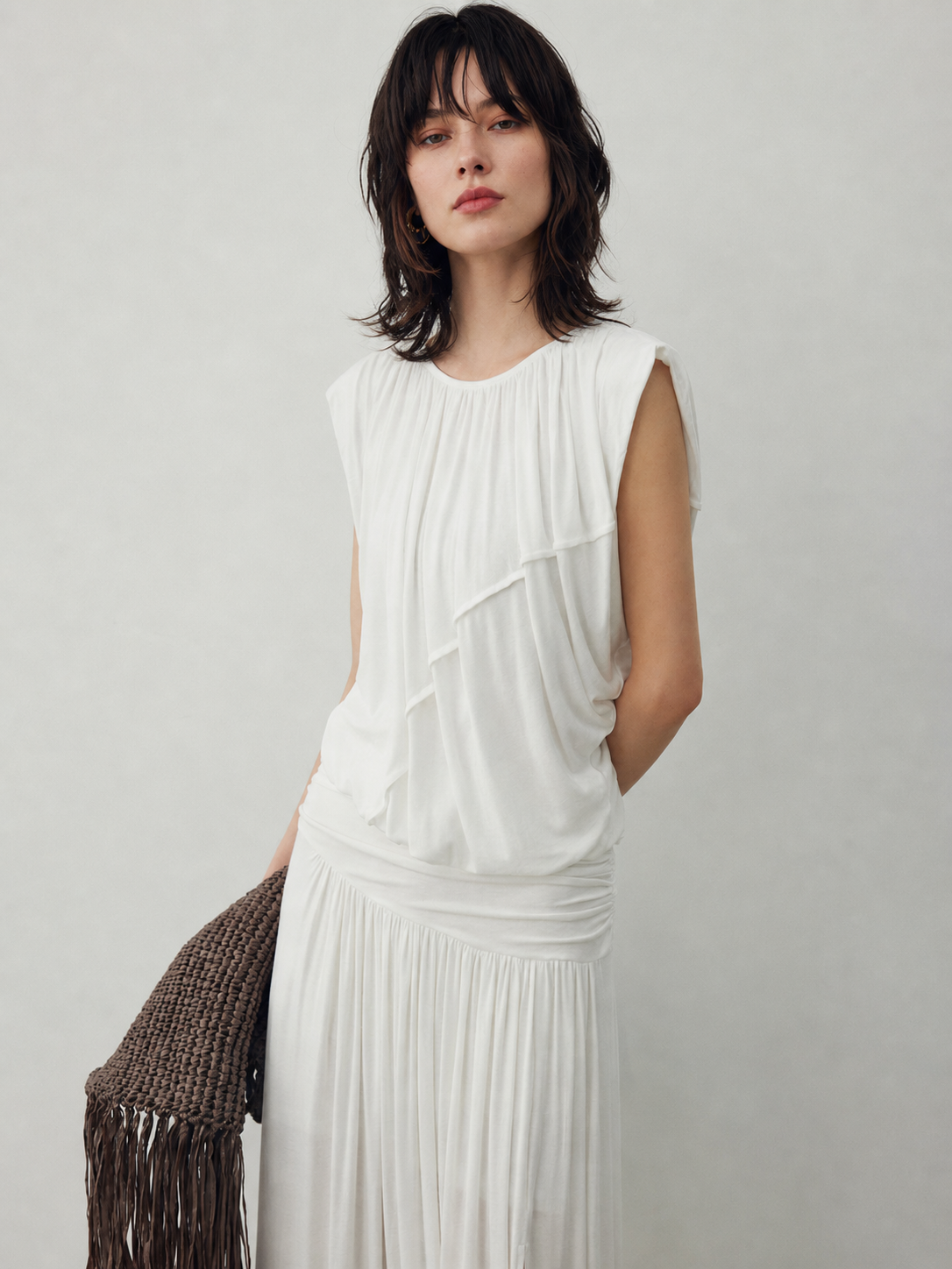 BapHood white sleeveless top with soft ruching, U neckline, and fluid layered texture.