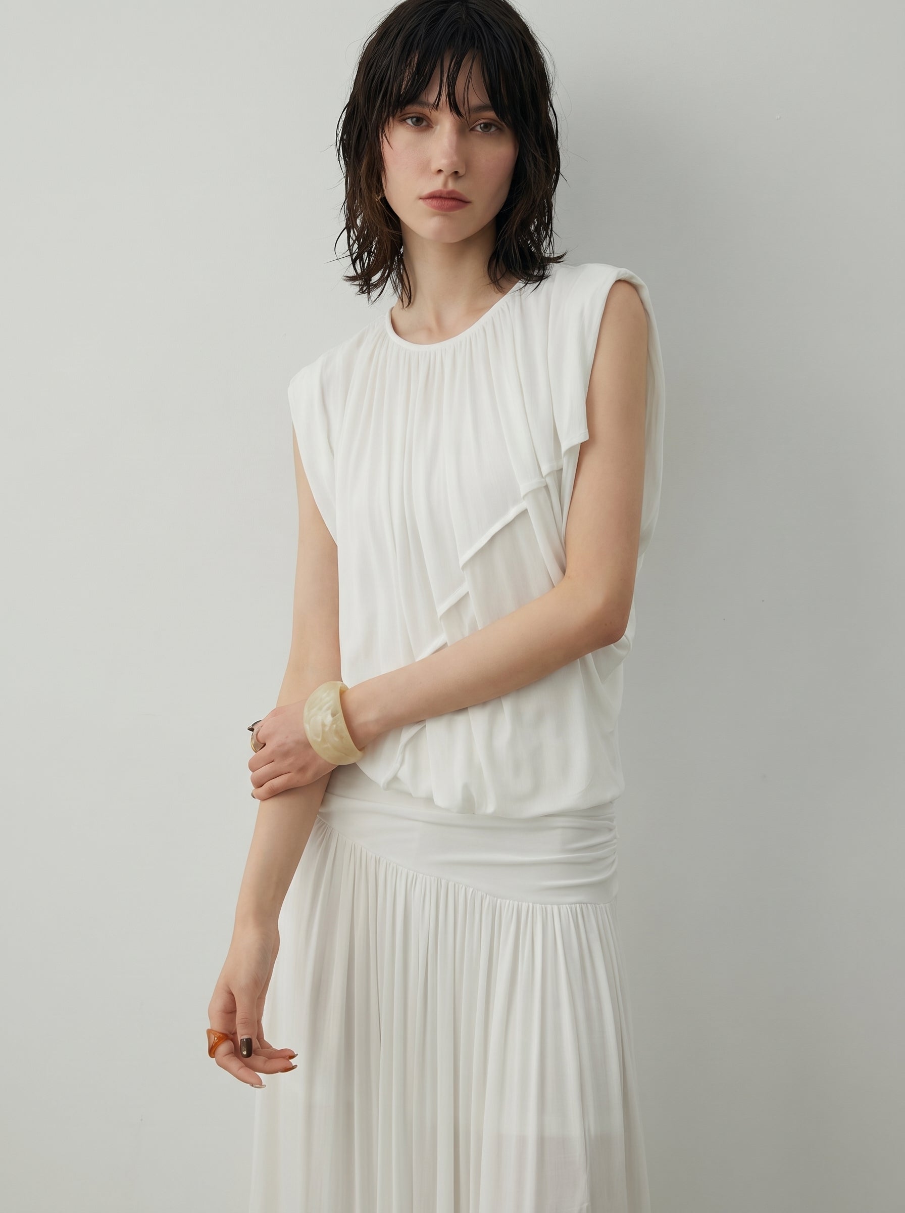 BapHood white ruched skirt set with a close view of the sleeveless top and deconstructed drape.
