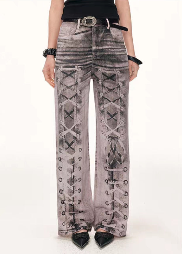 Front close-up of washed pants showing lace-up print detail on both legs