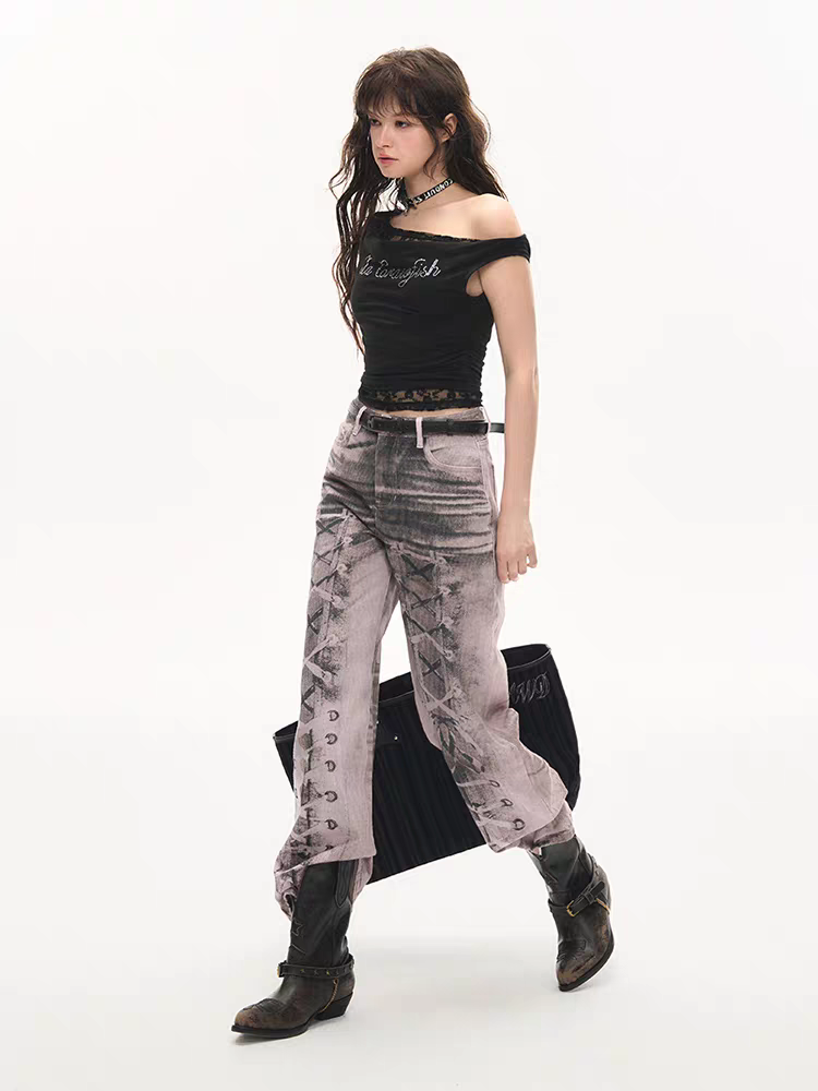 Side view of model wearing washed lace-up print pants, showing fit through hip and leg