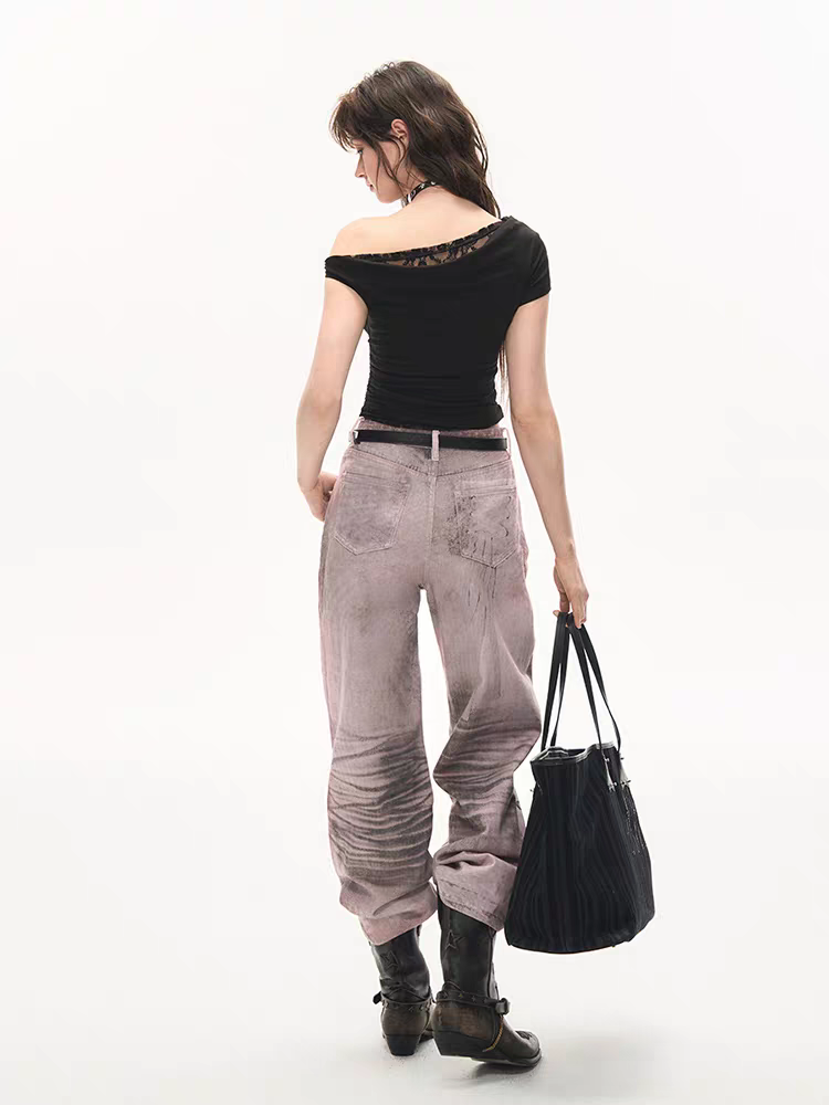 Back close-up of washed pants showing pocket detail and subtle flare hem