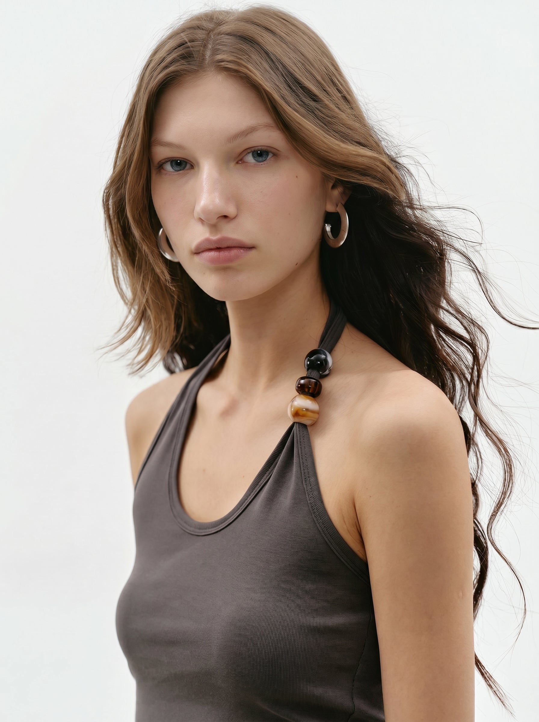 Close-up of charcoal beaded halter tank with halter neckline