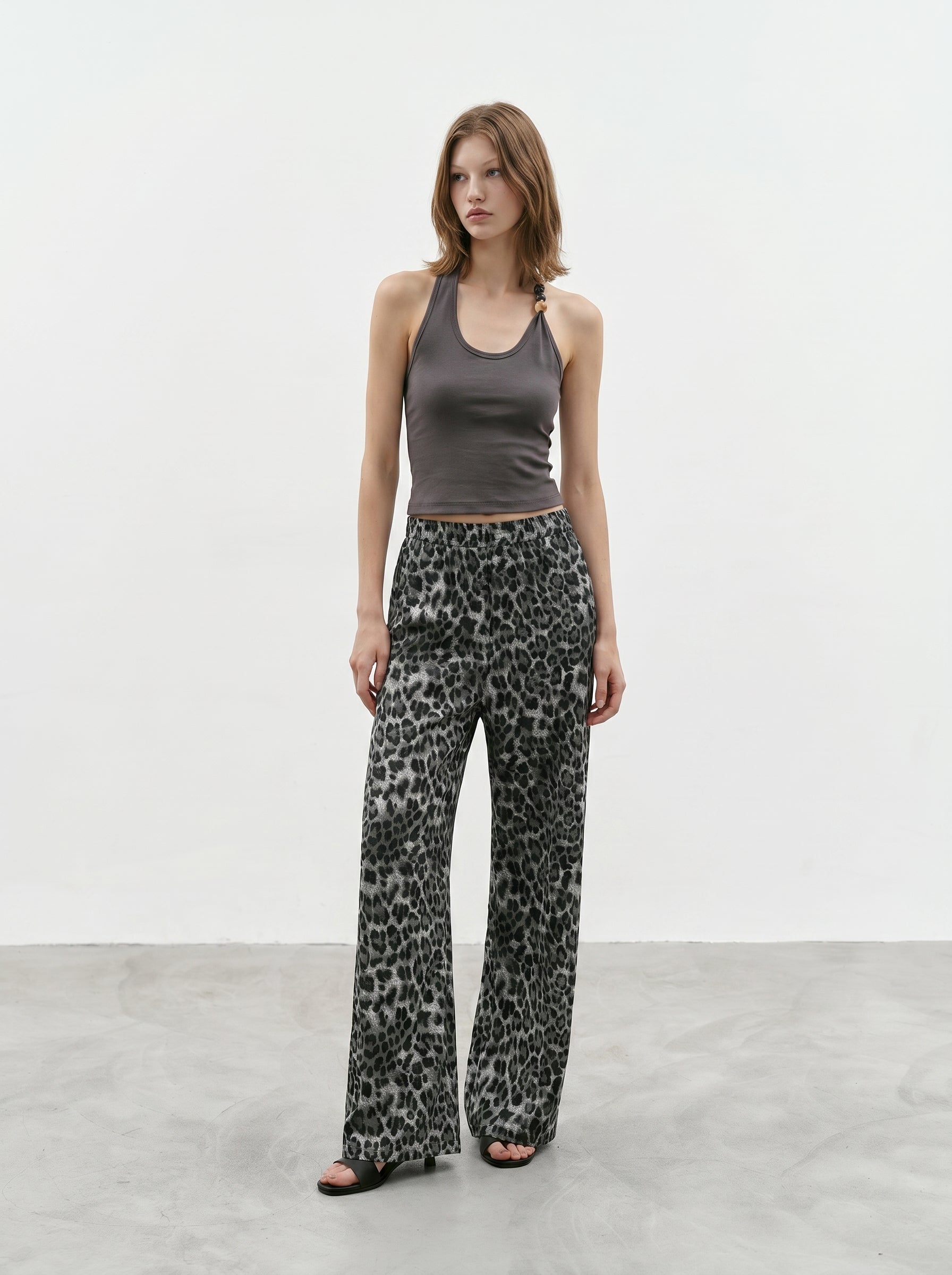 Charcoal beaded halter tank styled with printed wide leg pants