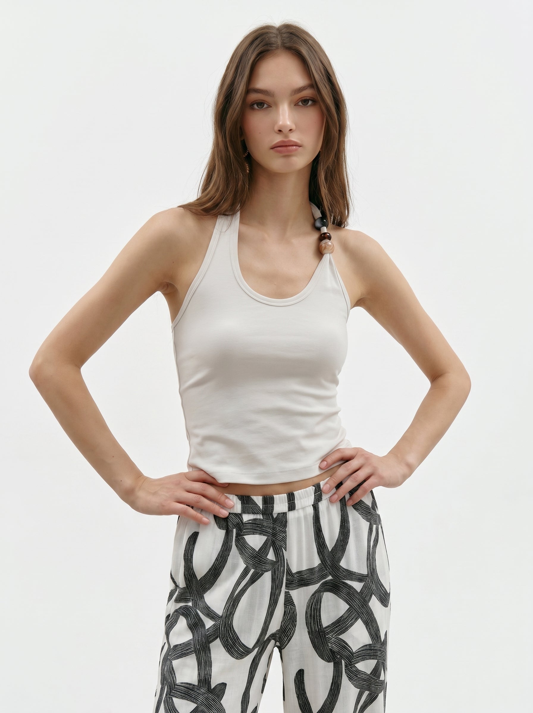 Cream beaded halter tank front view with statement bead detail