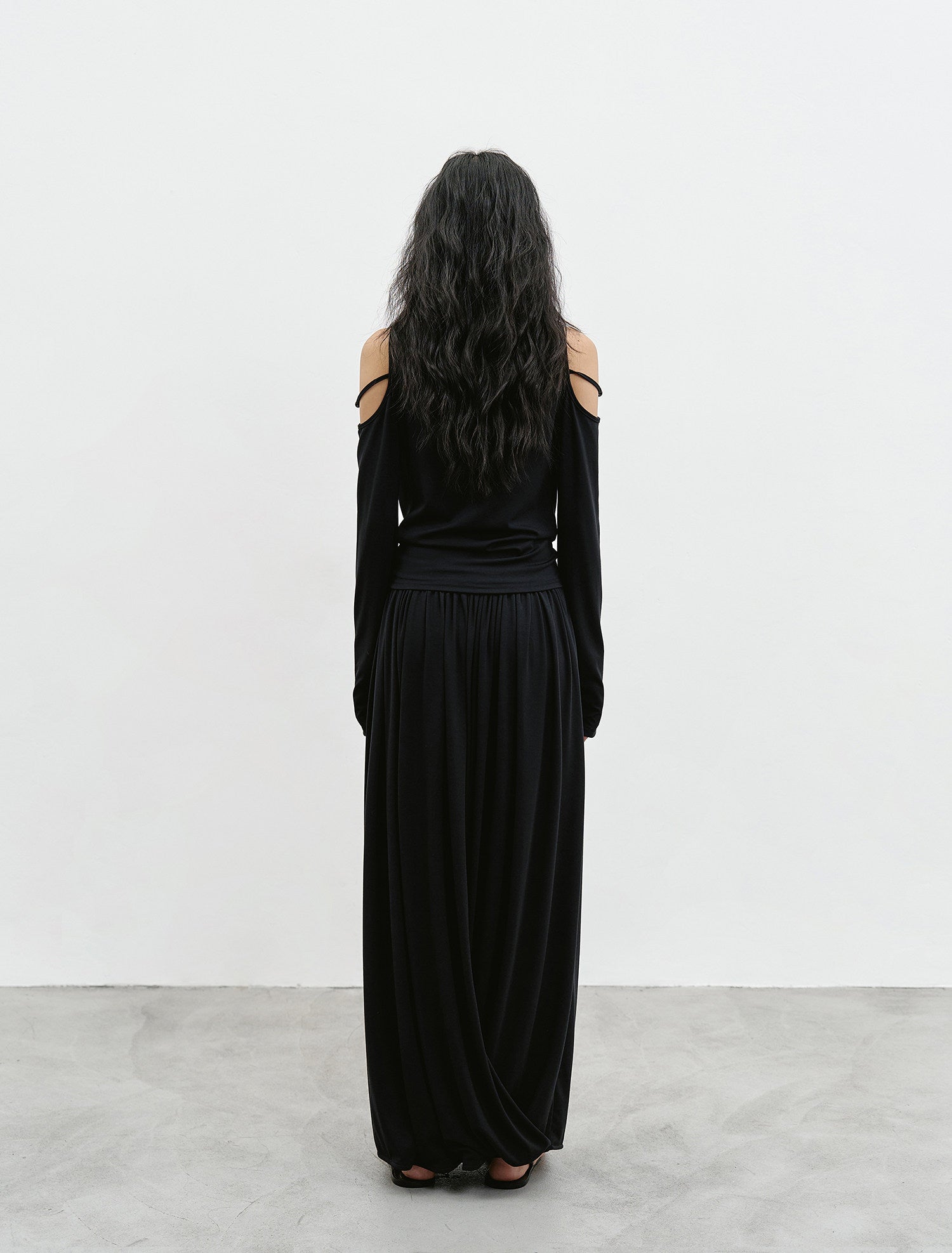 Black off shoulder top and maxi skirt set back view