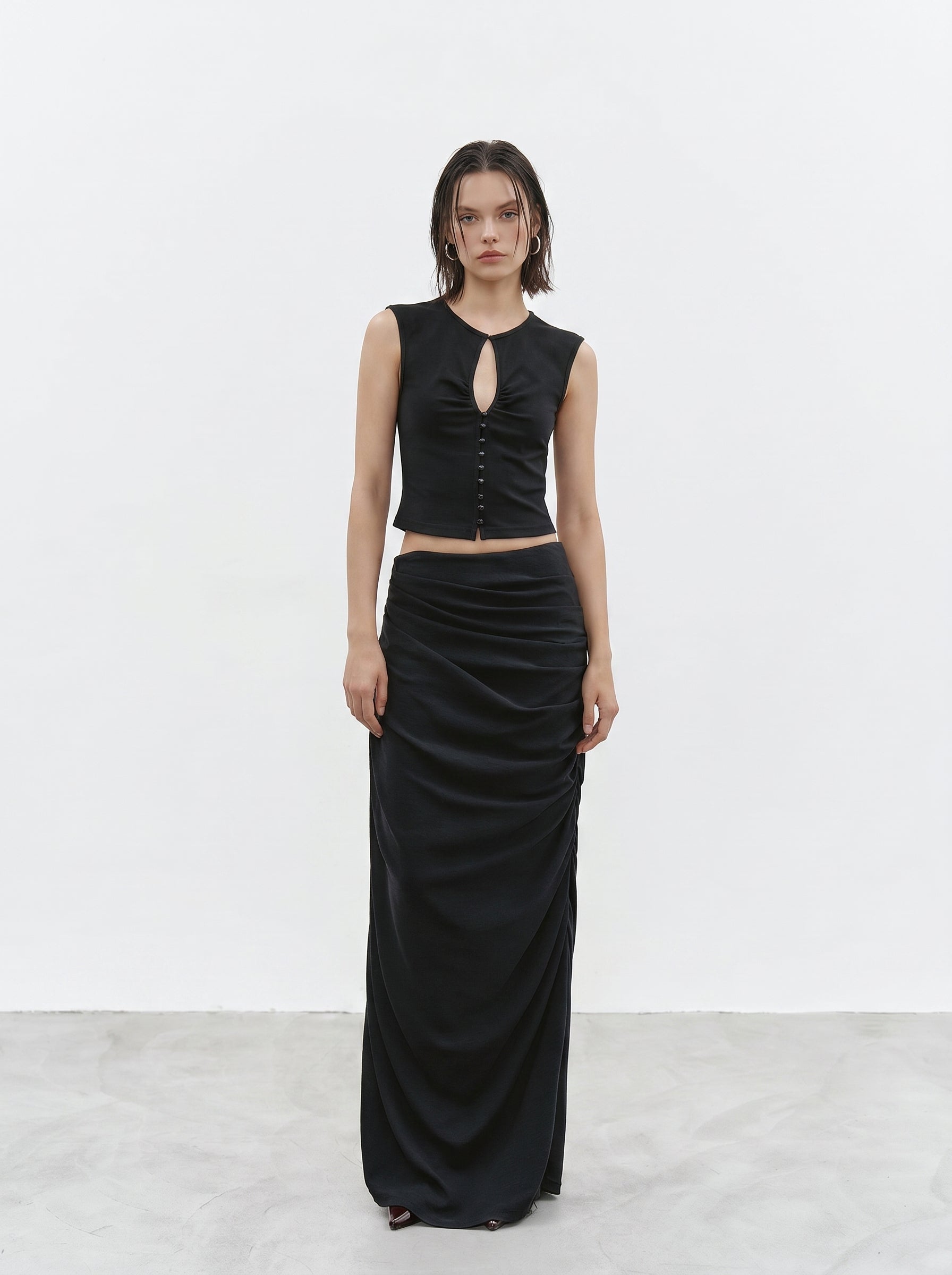 Black ruched maxi skirt styled with sleeveless button top