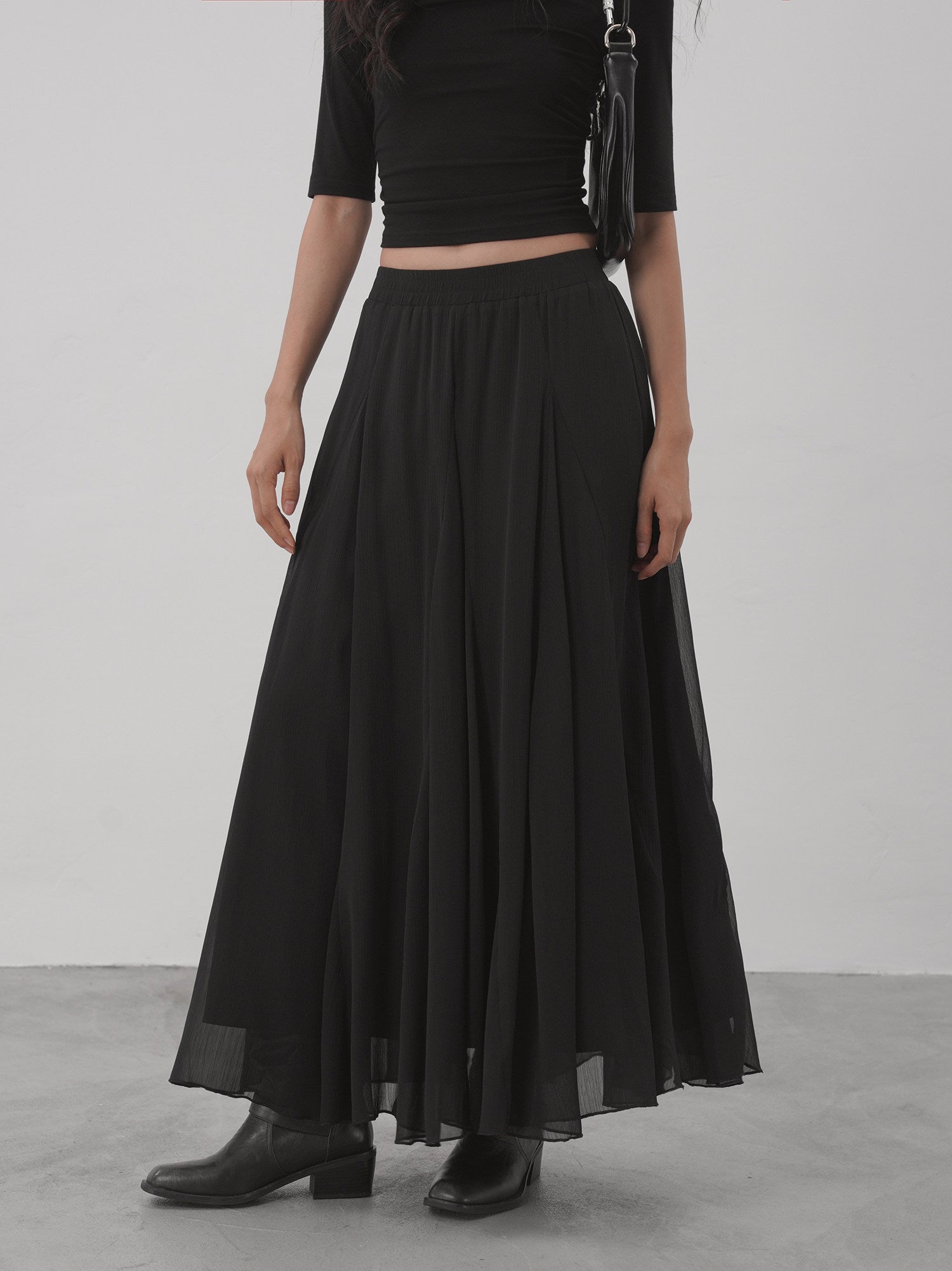 Black sheer flared maxi skirt front view with soft sheer hem