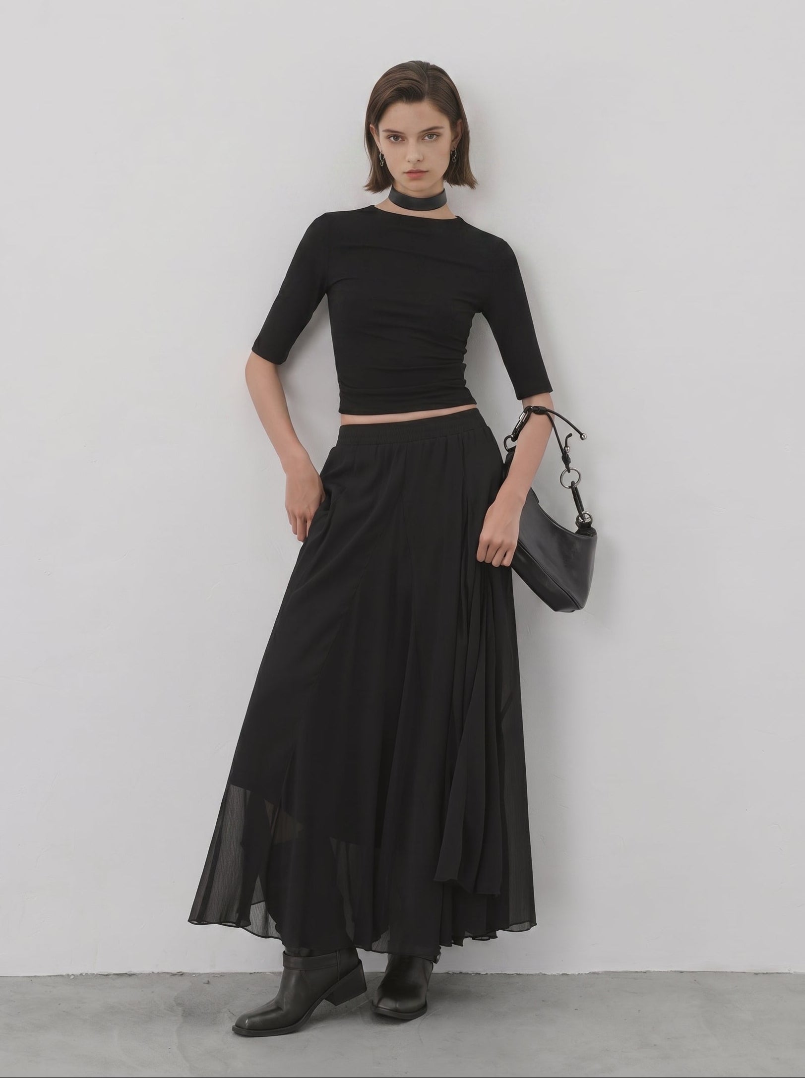 Black sheer flared maxi skirt styled with fitted short sleeve top