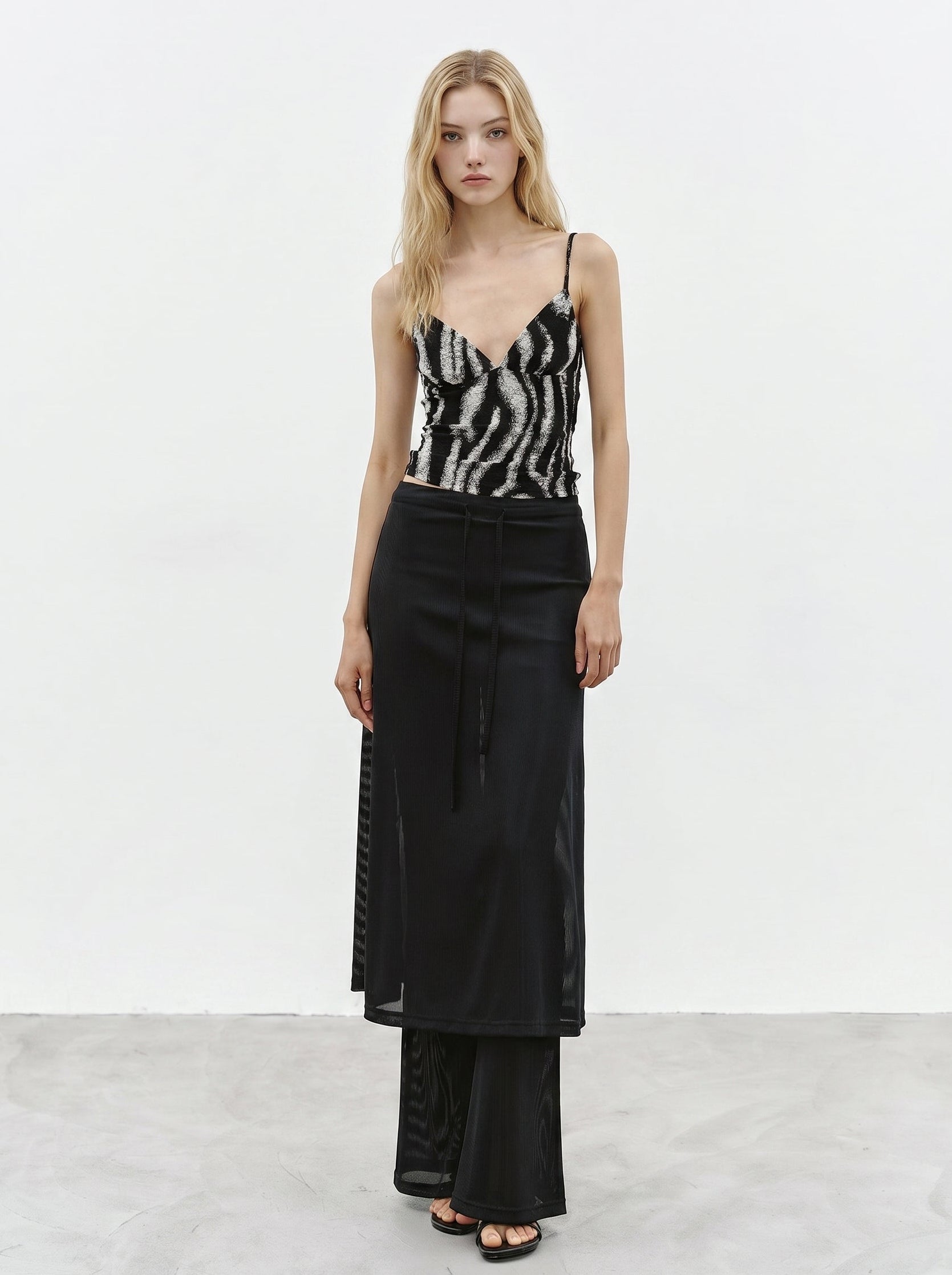 Black sheer layered maxi skirt styled with printed cami top