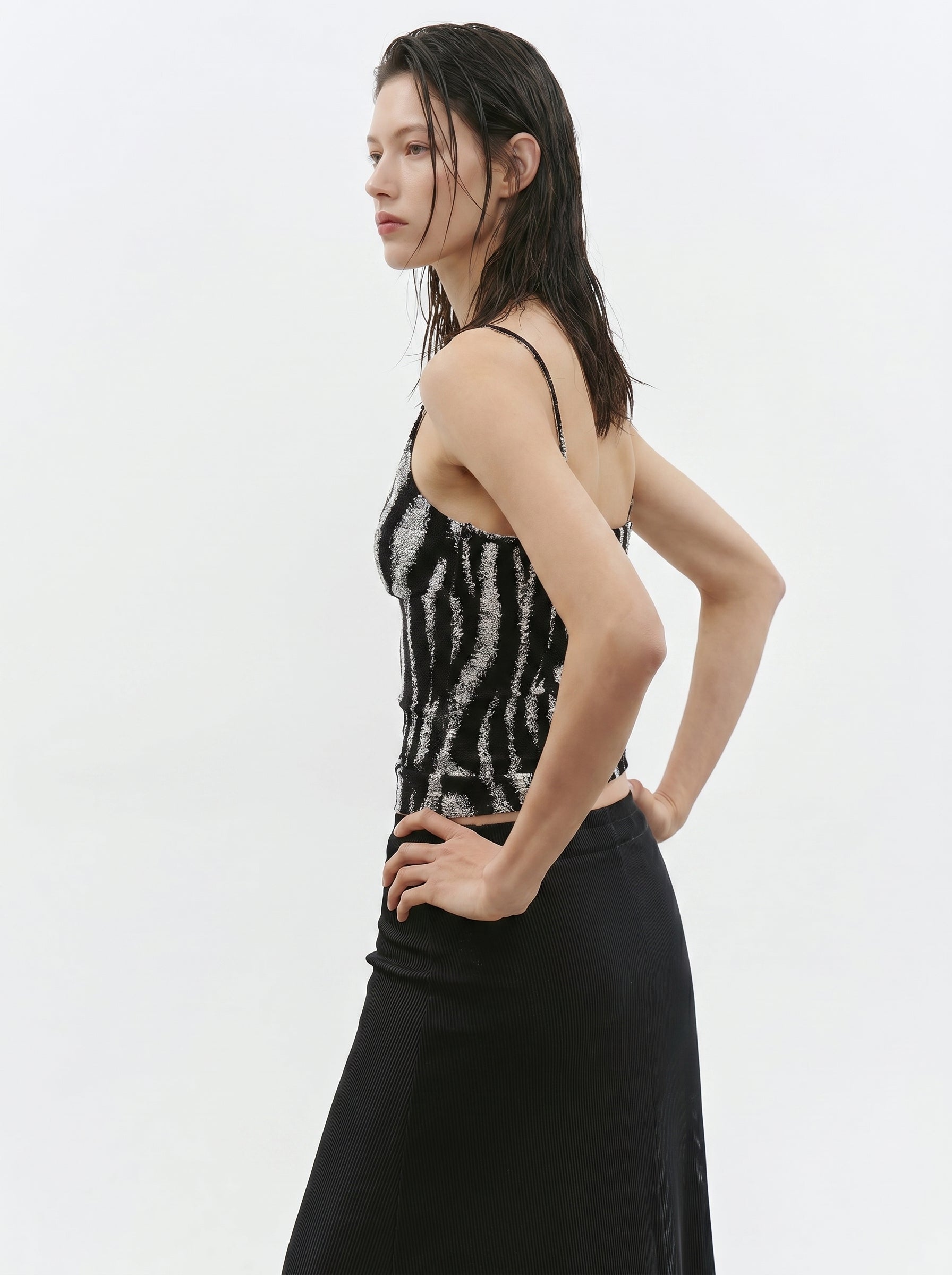Side view of black white zebra print V neck cami top