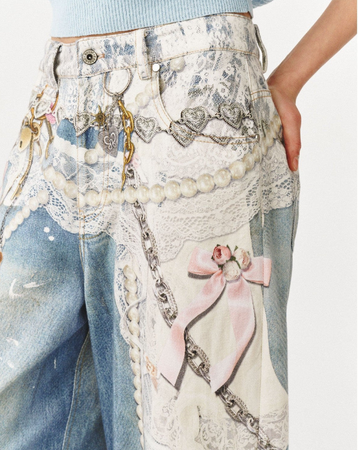 Waist detail of Blue Lace Chain Graphic Wide Leg Jeans with lace and chain graphic