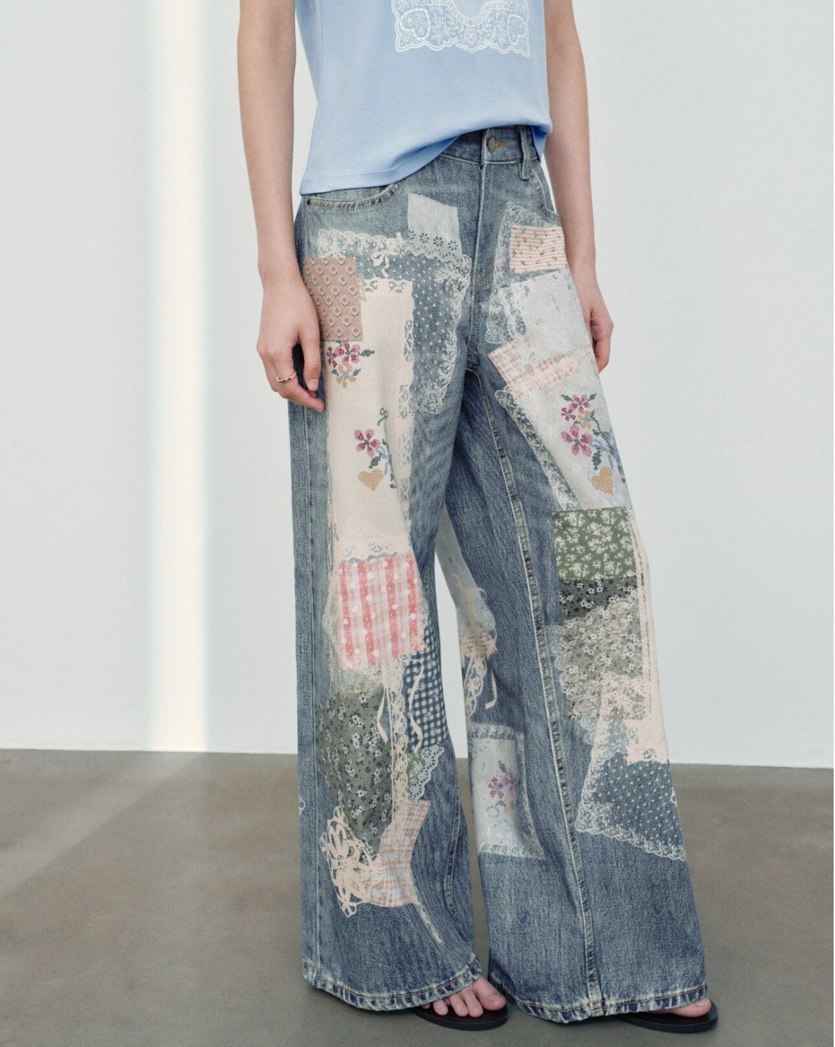 Blue Patchwork Floral Print Wide Leg Jeans front angled view