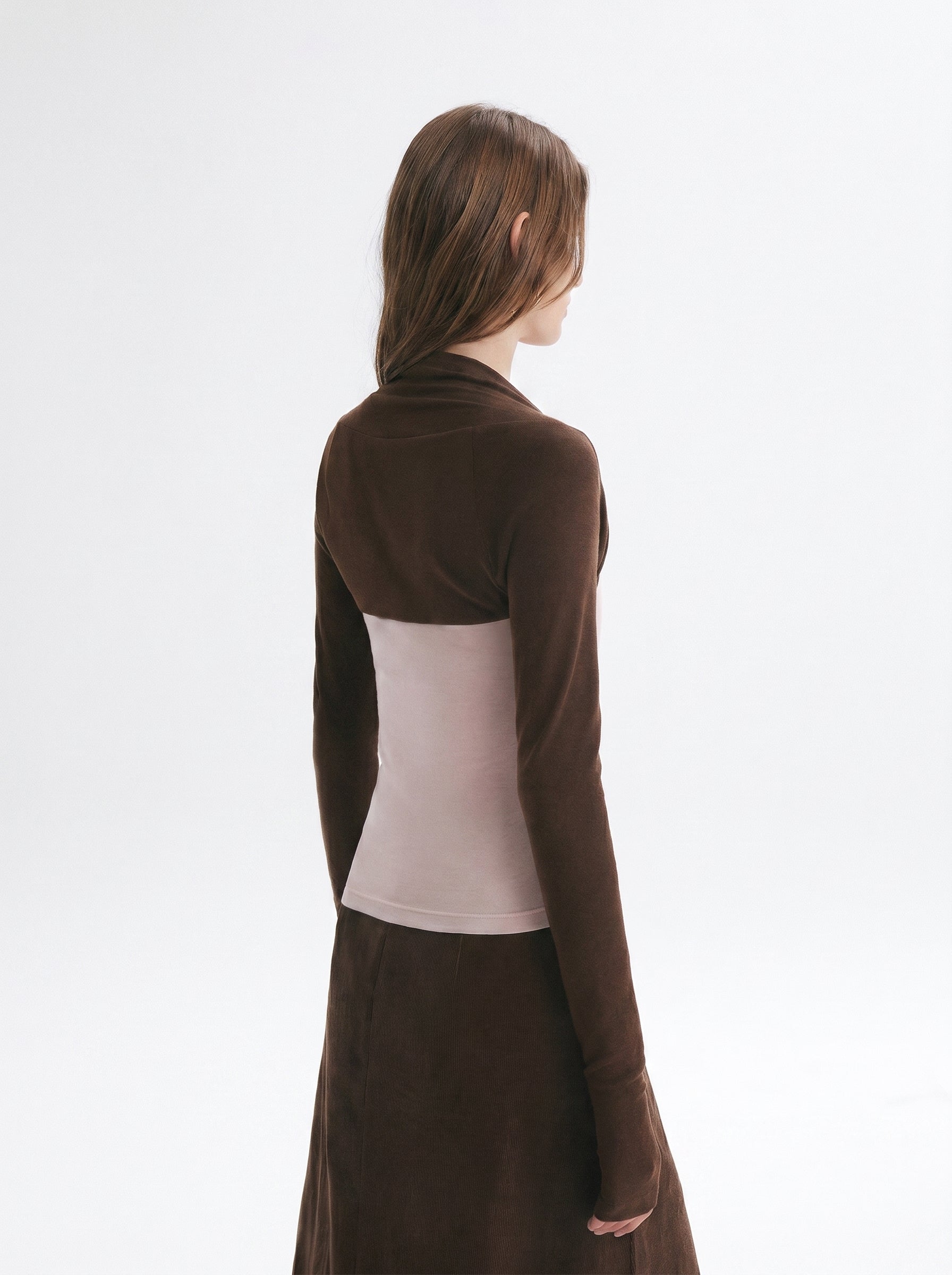 Back view of brown layered long sleeve top and midi skirt set showing the contrast faux two-piece design