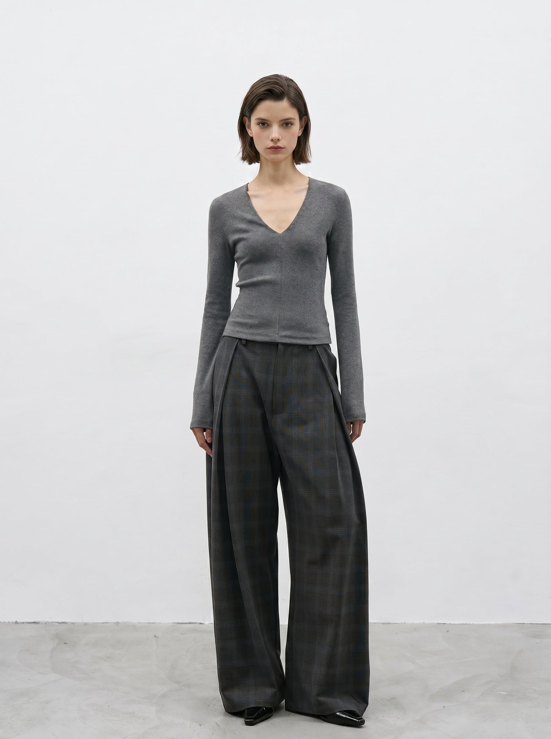 Charcoal plaid wide leg pants full body look with gray fitted top