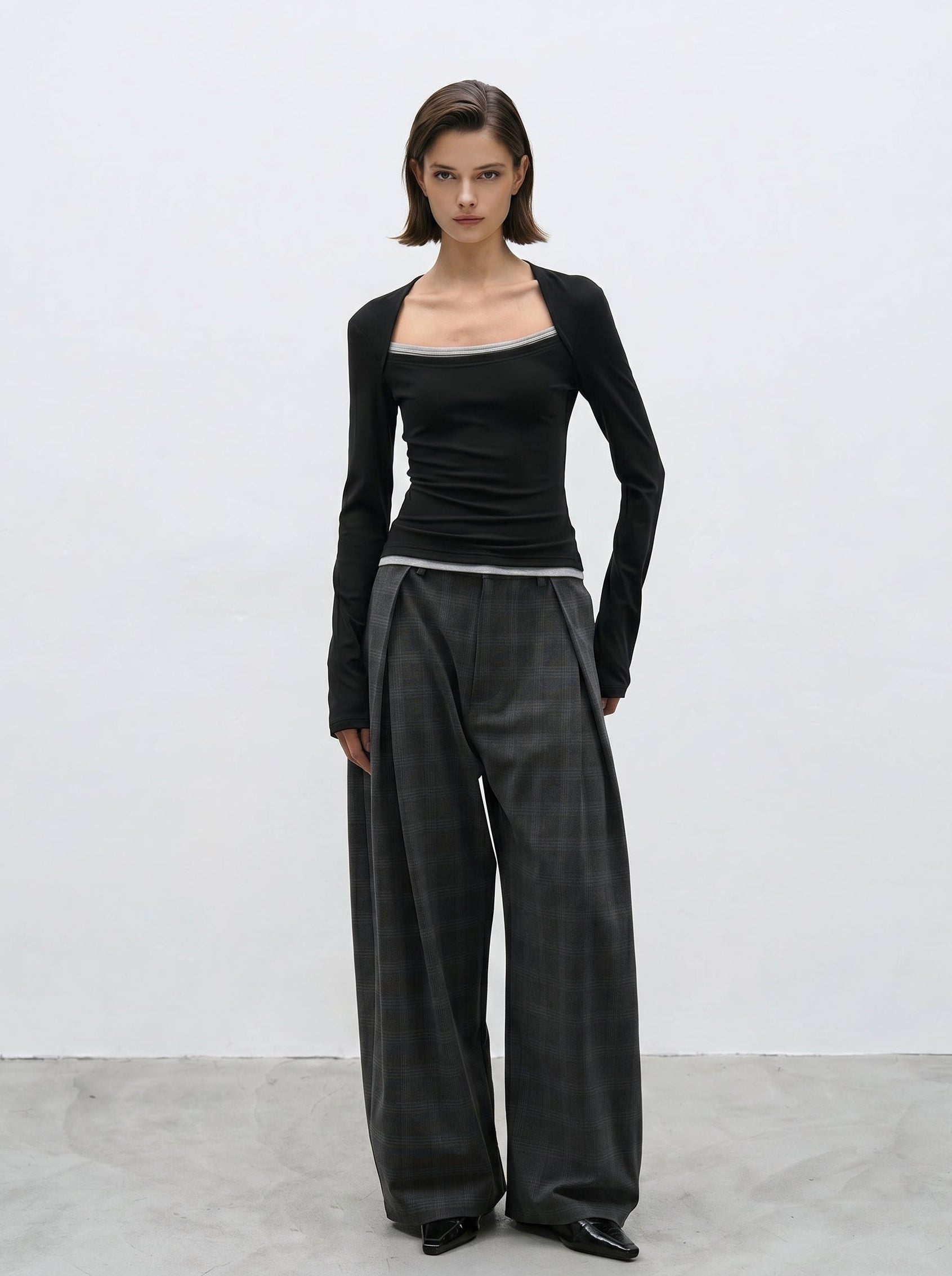 Charcoal plaid wide leg pants styled with black long sleeve top