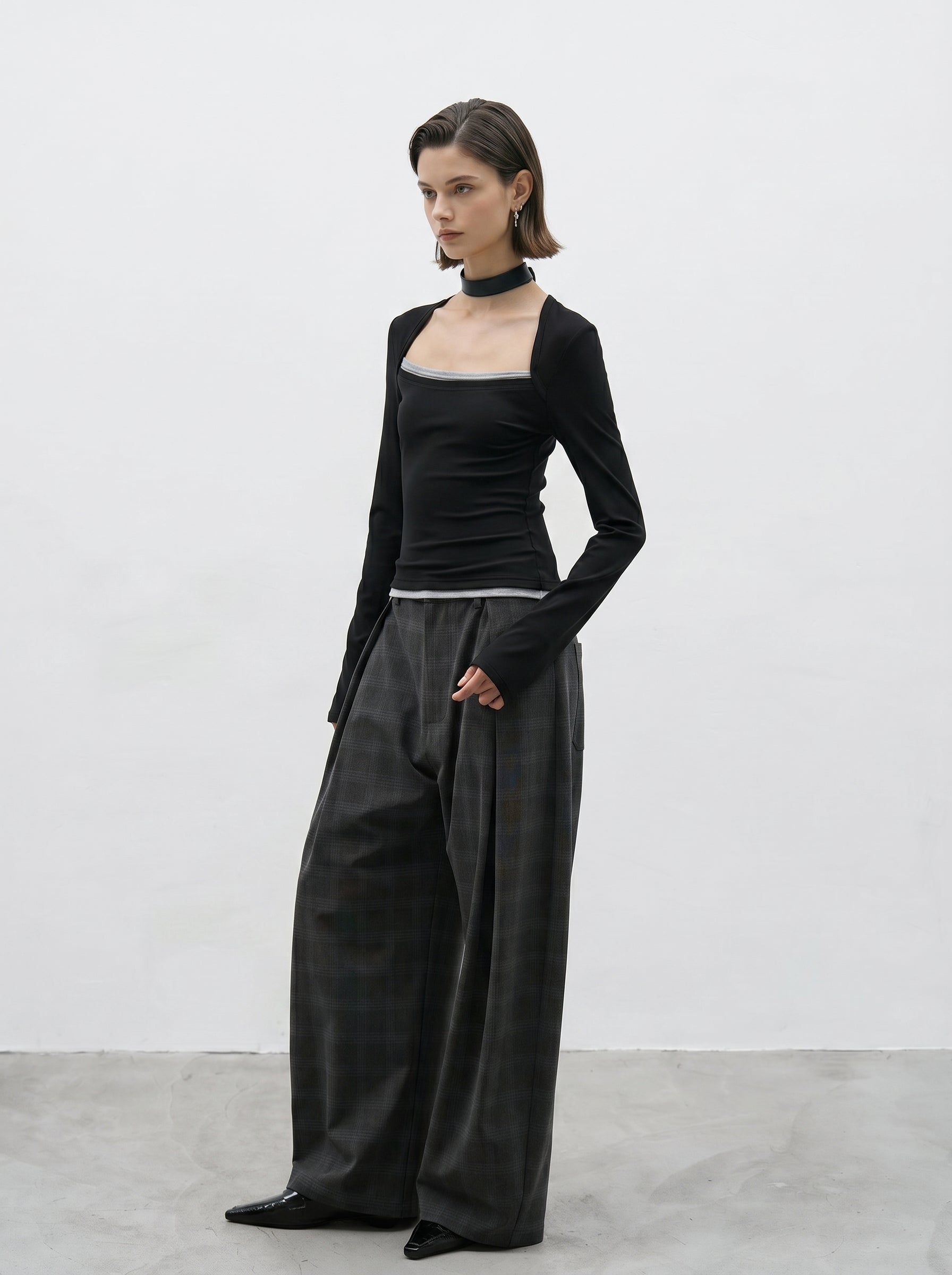 Charcoal plaid wide leg pants side view showing wide leg silhouette
