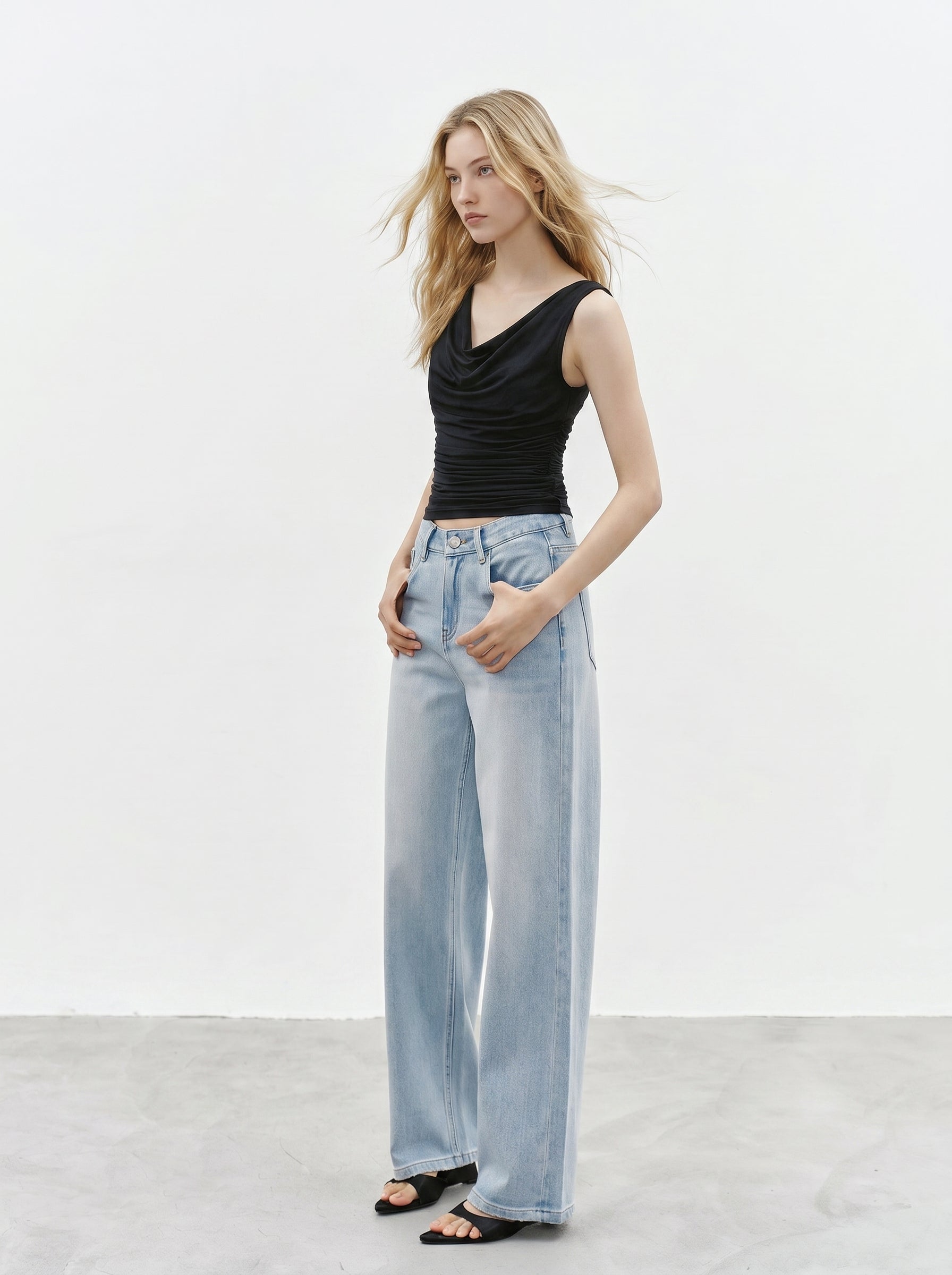 Black cowl neck sleeveless top full body look with light wash jeans