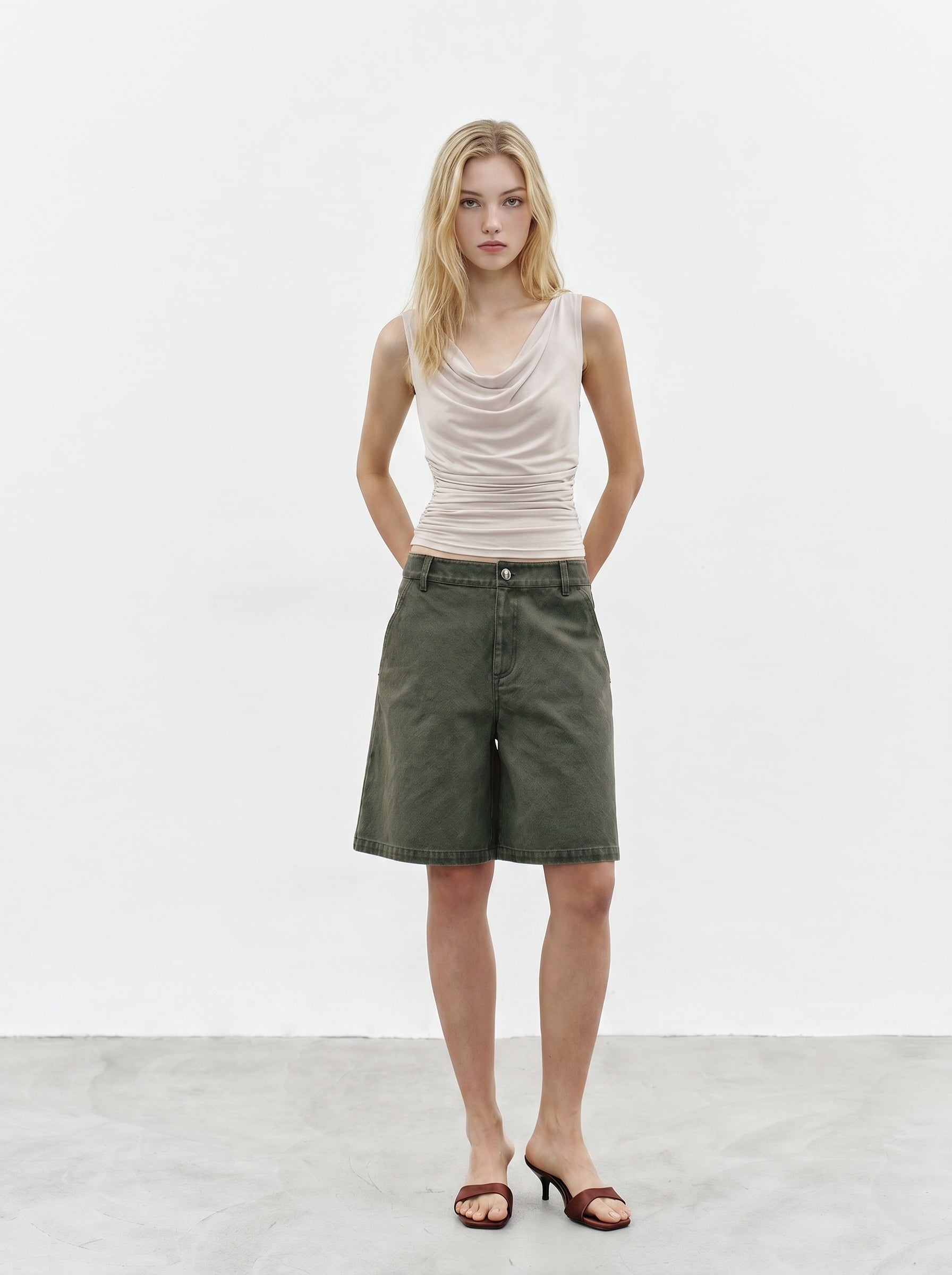 Cream cowl neck sleeveless top full body look with olive cargo pants