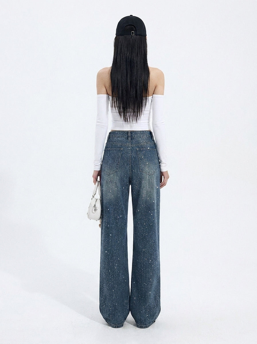 Back view of dark wash rhinestone wide leg jeans showing loose fit and denim details