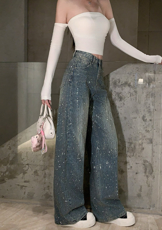 Side view of dark wash rhinestone wide leg jeans showing relaxed silhouette and sparkle details