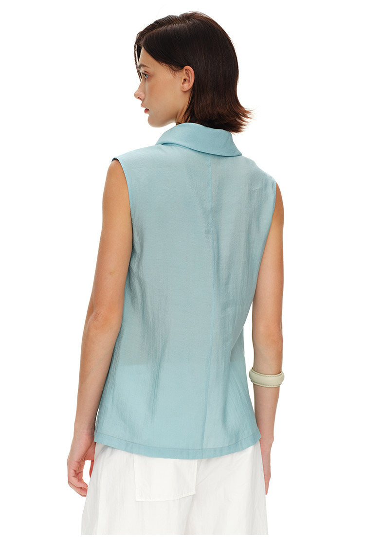 Back view of light blue sleeveless turtleneck top showing the clean center seam and high collar