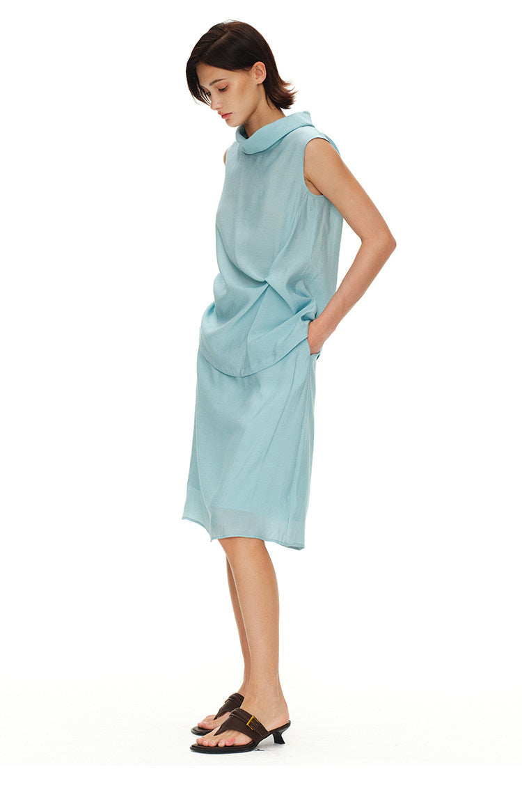 Back angled view of light blue sleeveless turtleneck top and midi skirt set