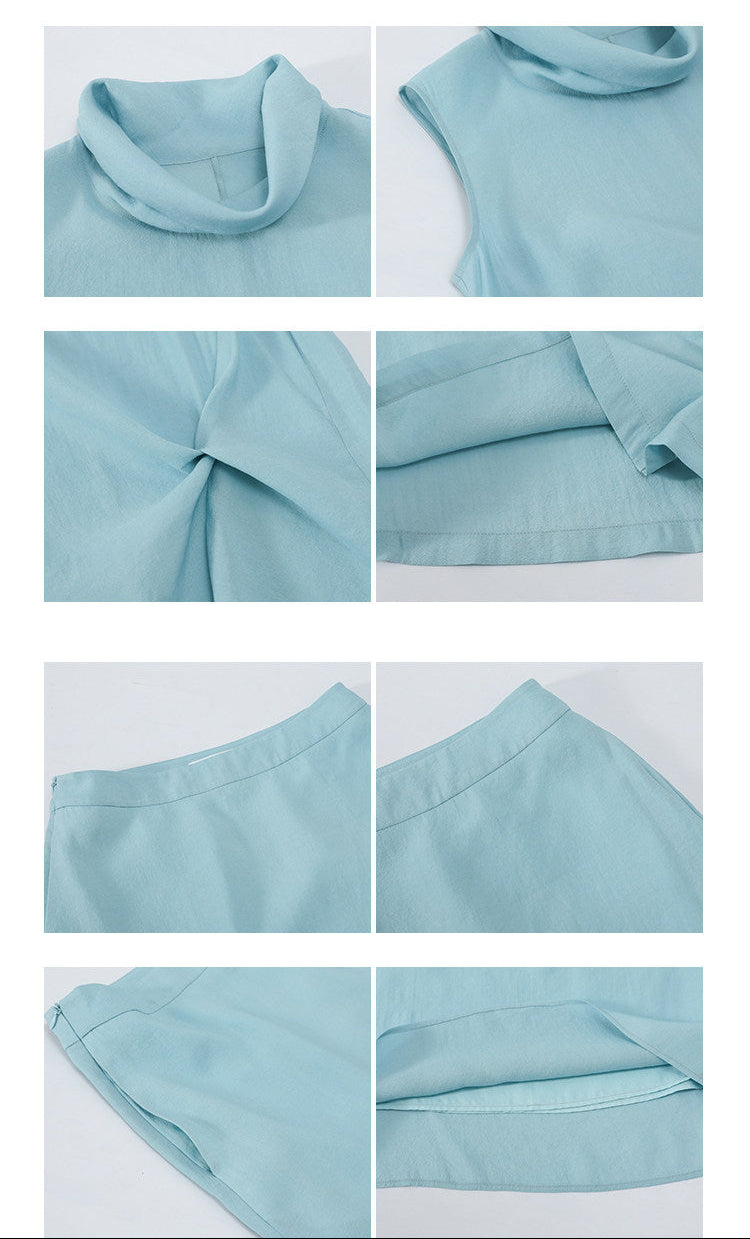 Detail display of light blue turtleneck top and midi skirt set showing collar, twist drape, waist, and fabric texture