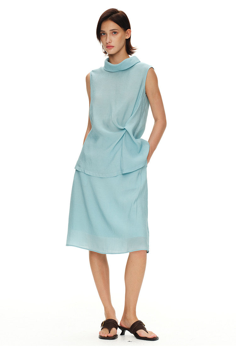 Light blue sleeveless top and midi skirt set shown in a relaxed front pose