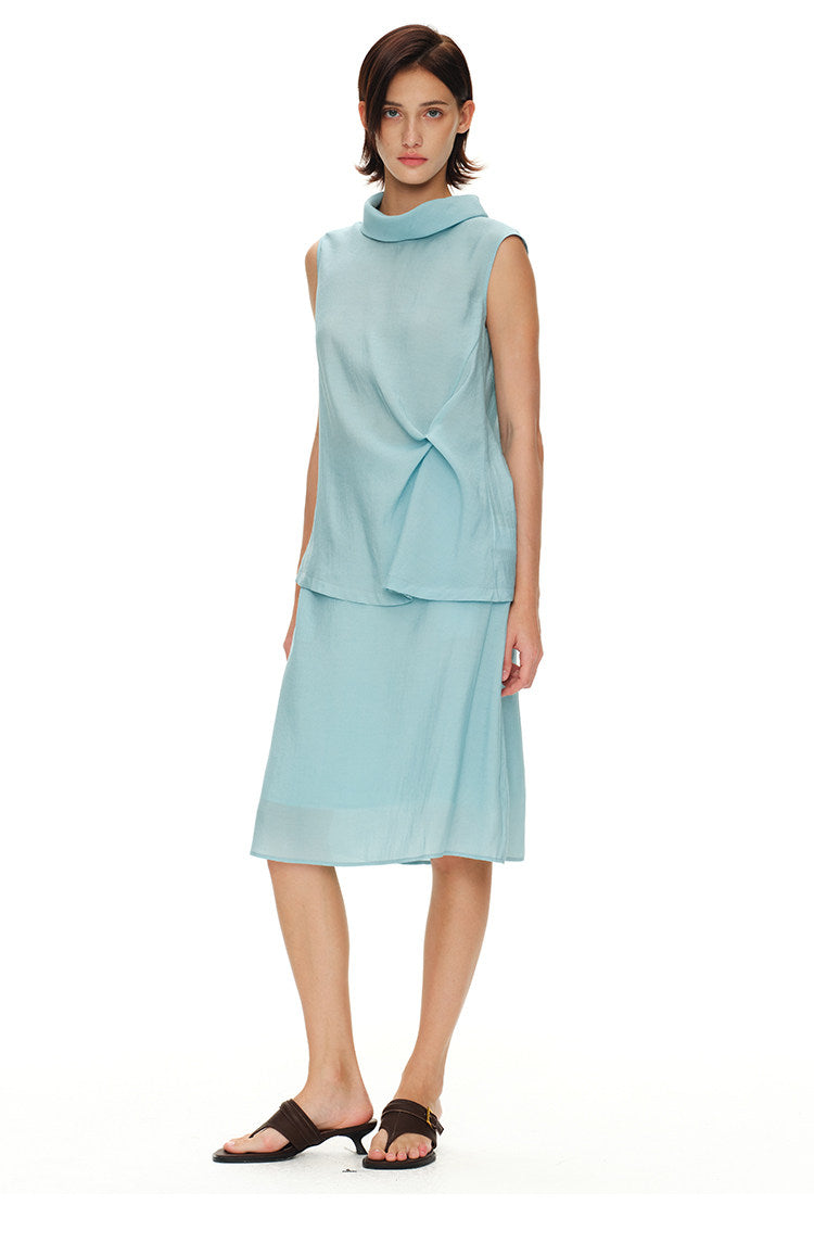 Front view of light blue sleeveless turtleneck top and matching midi skirt set