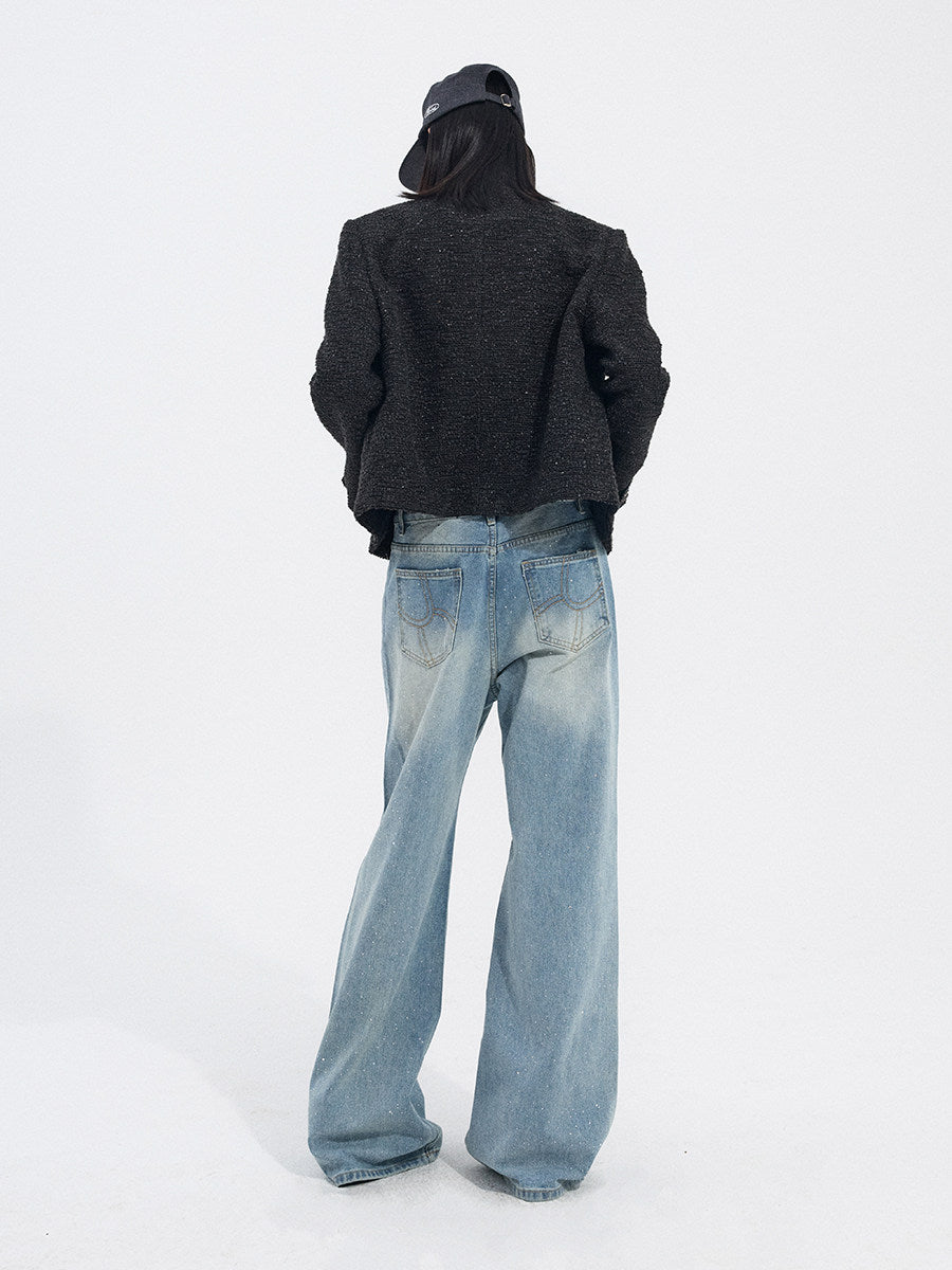 Model wearing light blue wide-leg jeans from the back with a relaxed streetwear styling