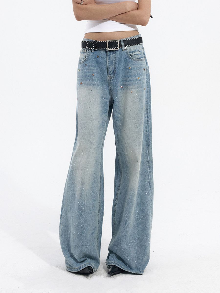 Full body front view of washed light blue wide-leg jeans styled with a minimal casual outfit
