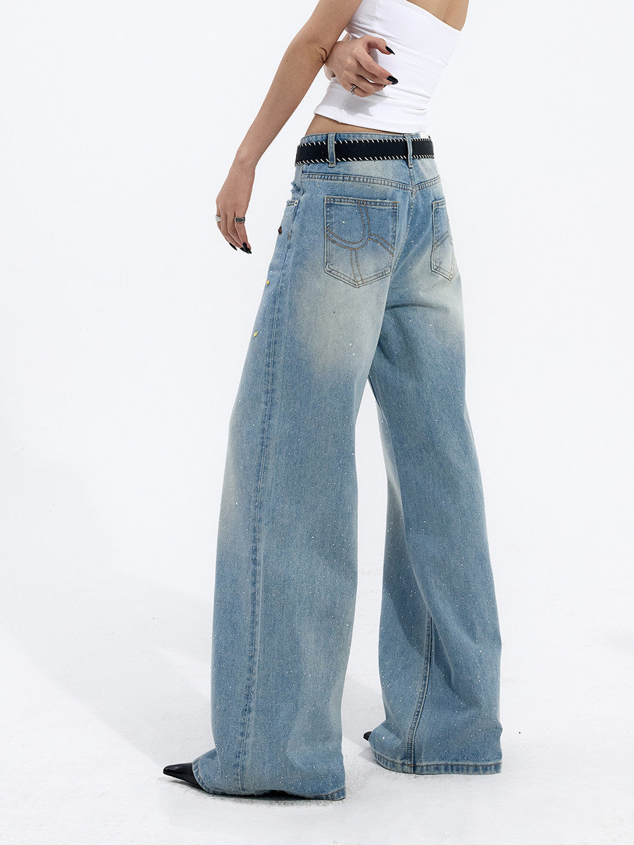 Three-quarter view of light blue wide-leg jeans highlighting the oversized silhouette and drape