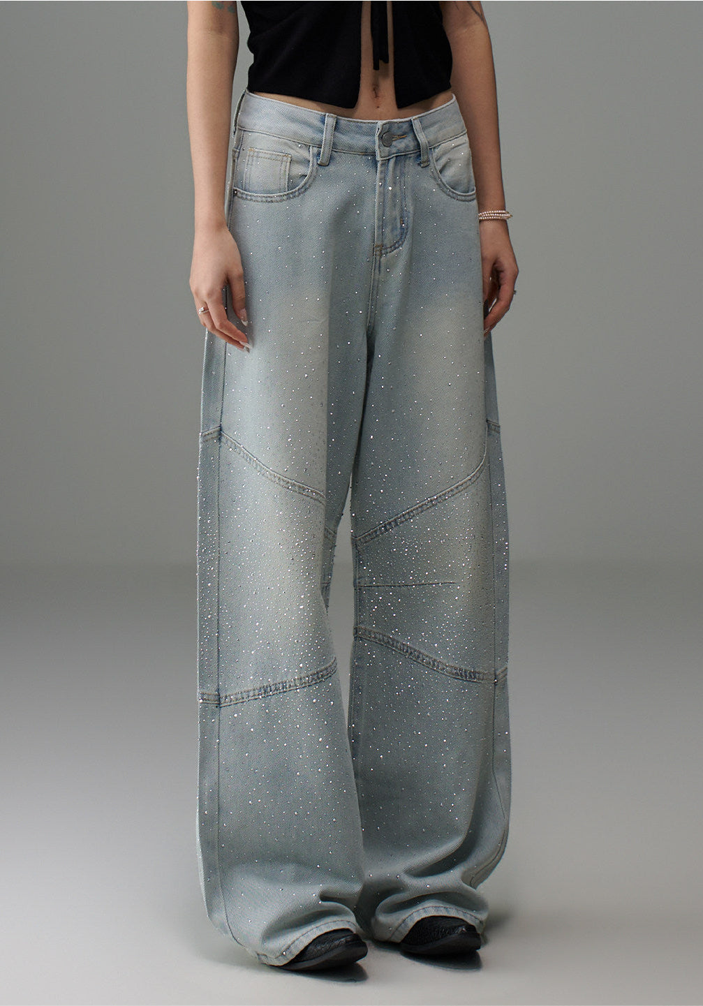 Full front view of light wash rhinestone wide leg jeans showing the oversized wide leg silhouette and floor-skimming length