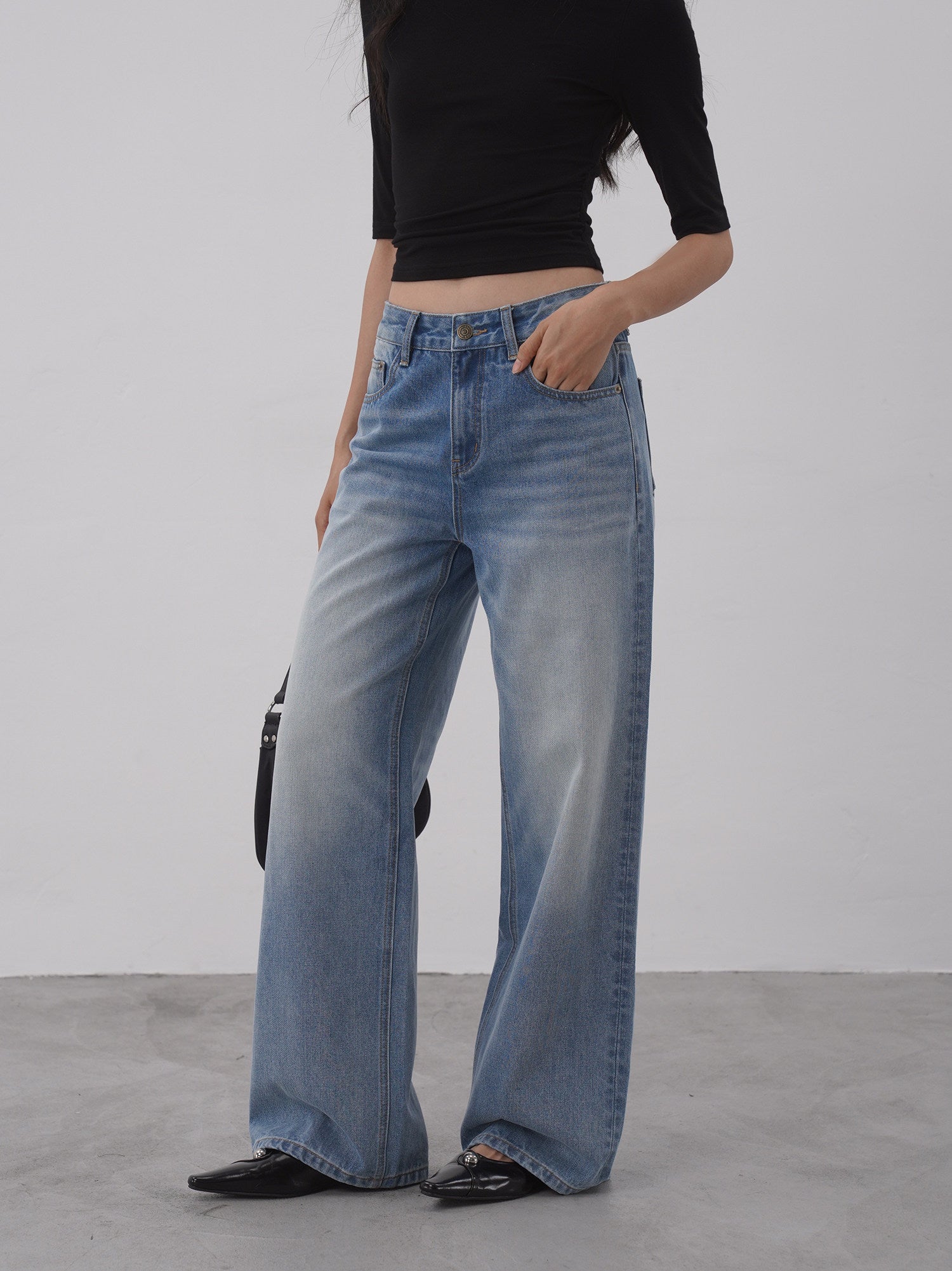 Light wash wide leg jeans front angle view
