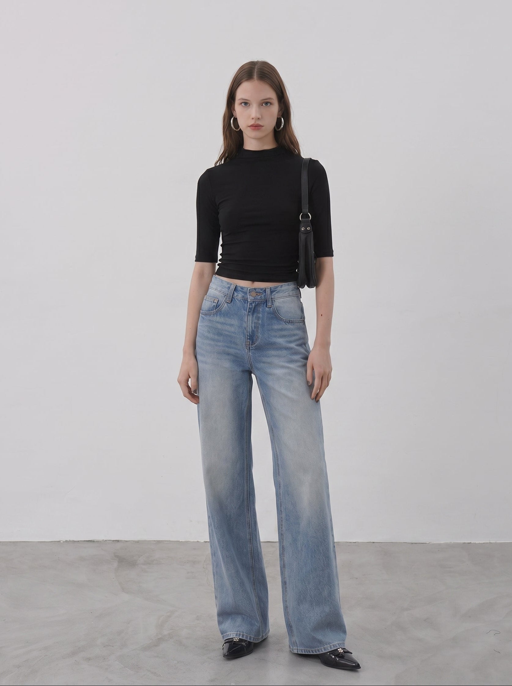 Light wash wide leg jeans styled with black fitted top