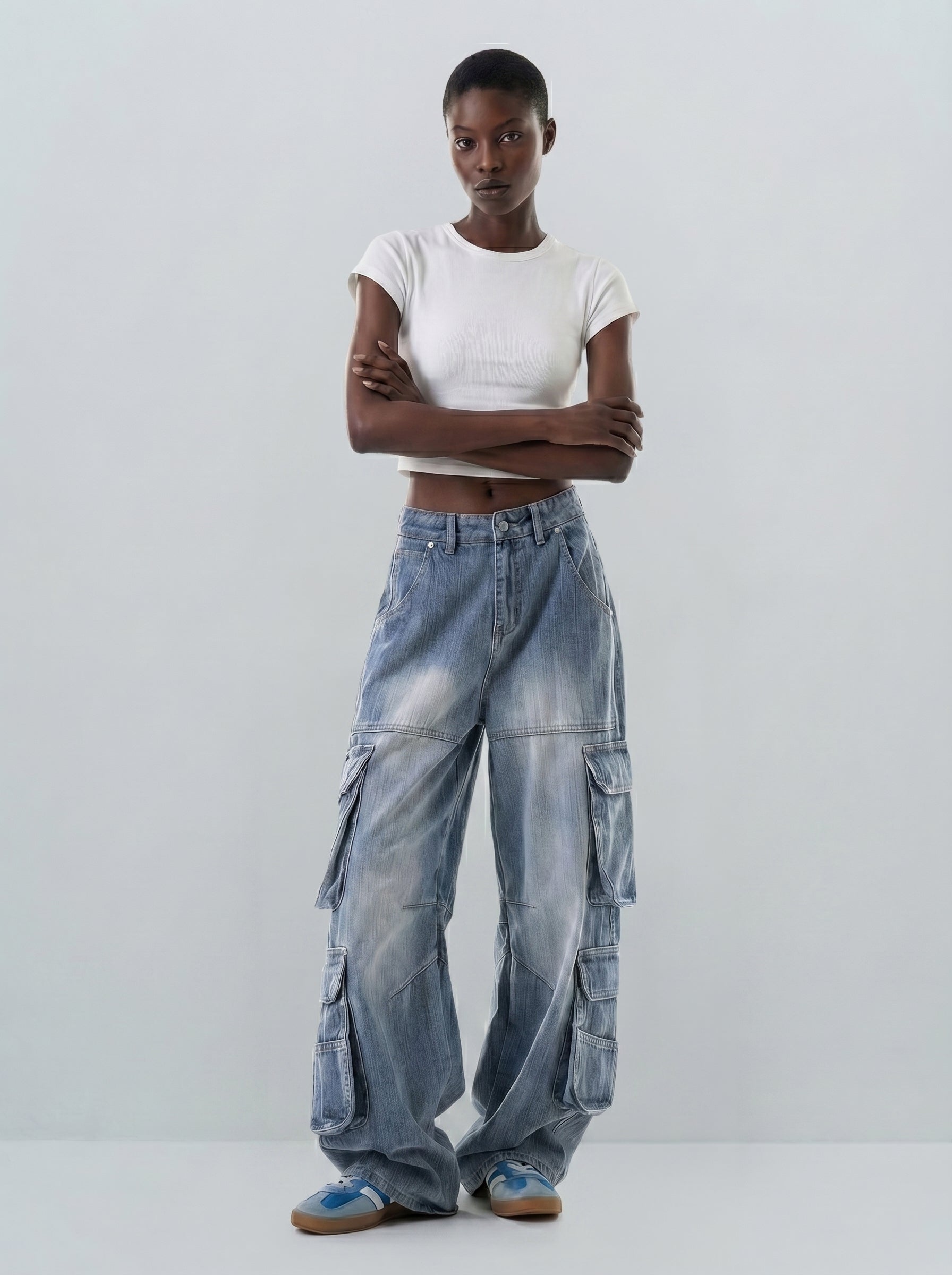 Full-body view of vintage washed multi-pocket cargo jeans in ice blue