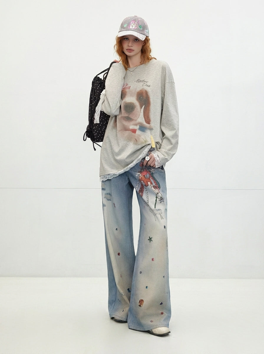 Washed Blue Layered Waist Graphic Wide Leg Jeans styled with oversized graphic sweatshirt