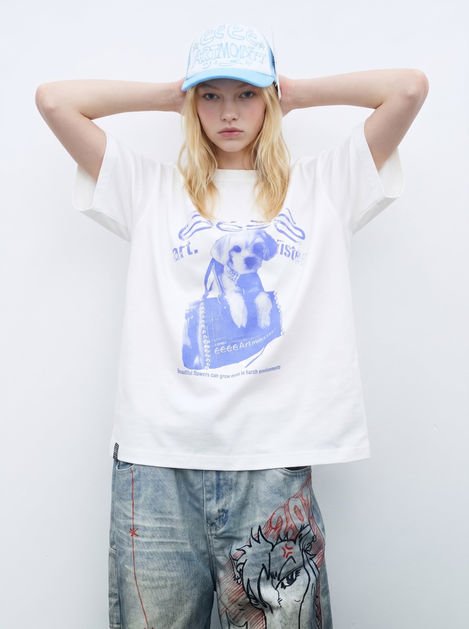 Front detail of oversized white graphic T-shirt with black dog print and relaxed dropped shoulder sleeves