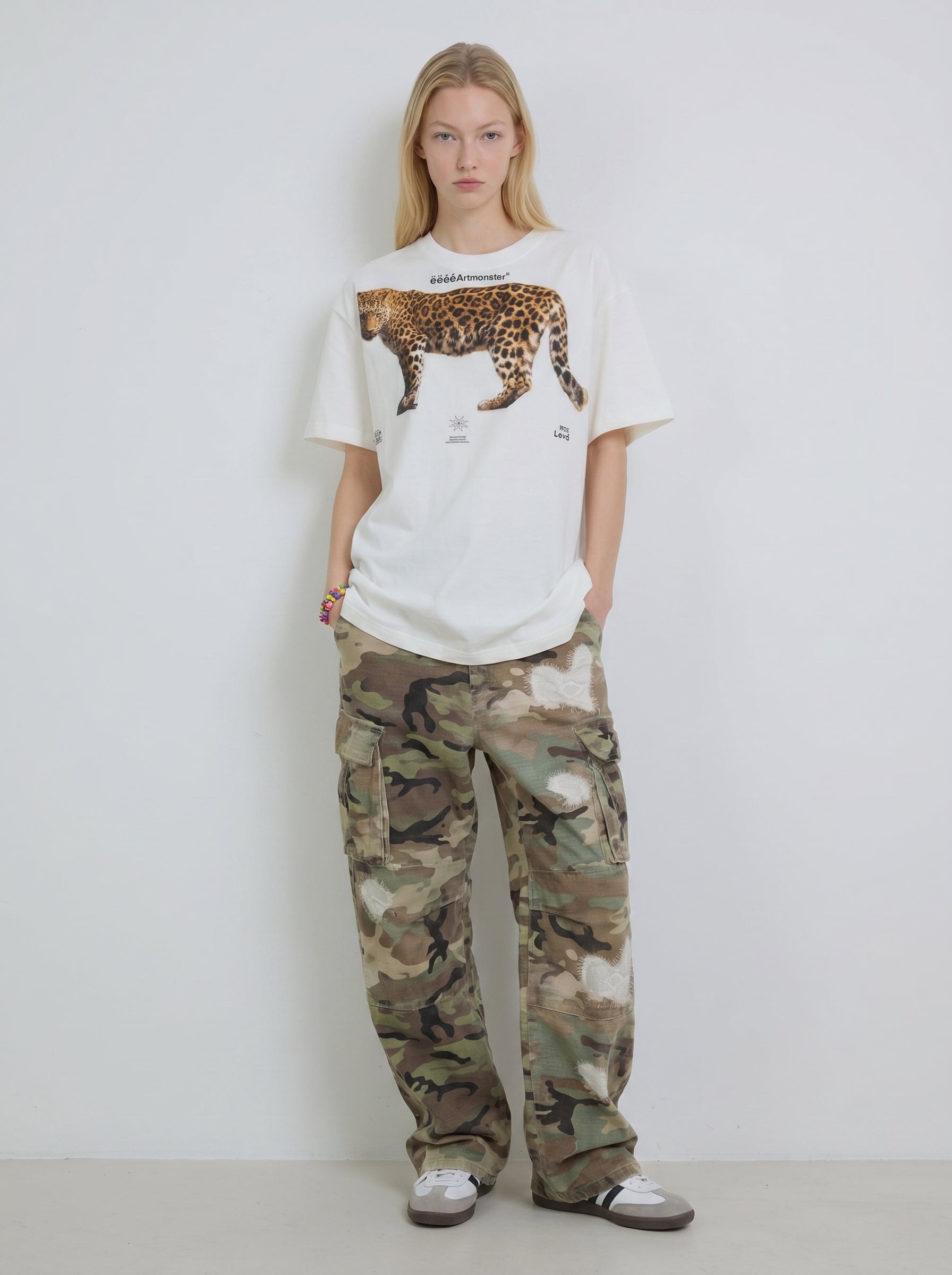 white oversized T-shirt with a leopard graphic print,